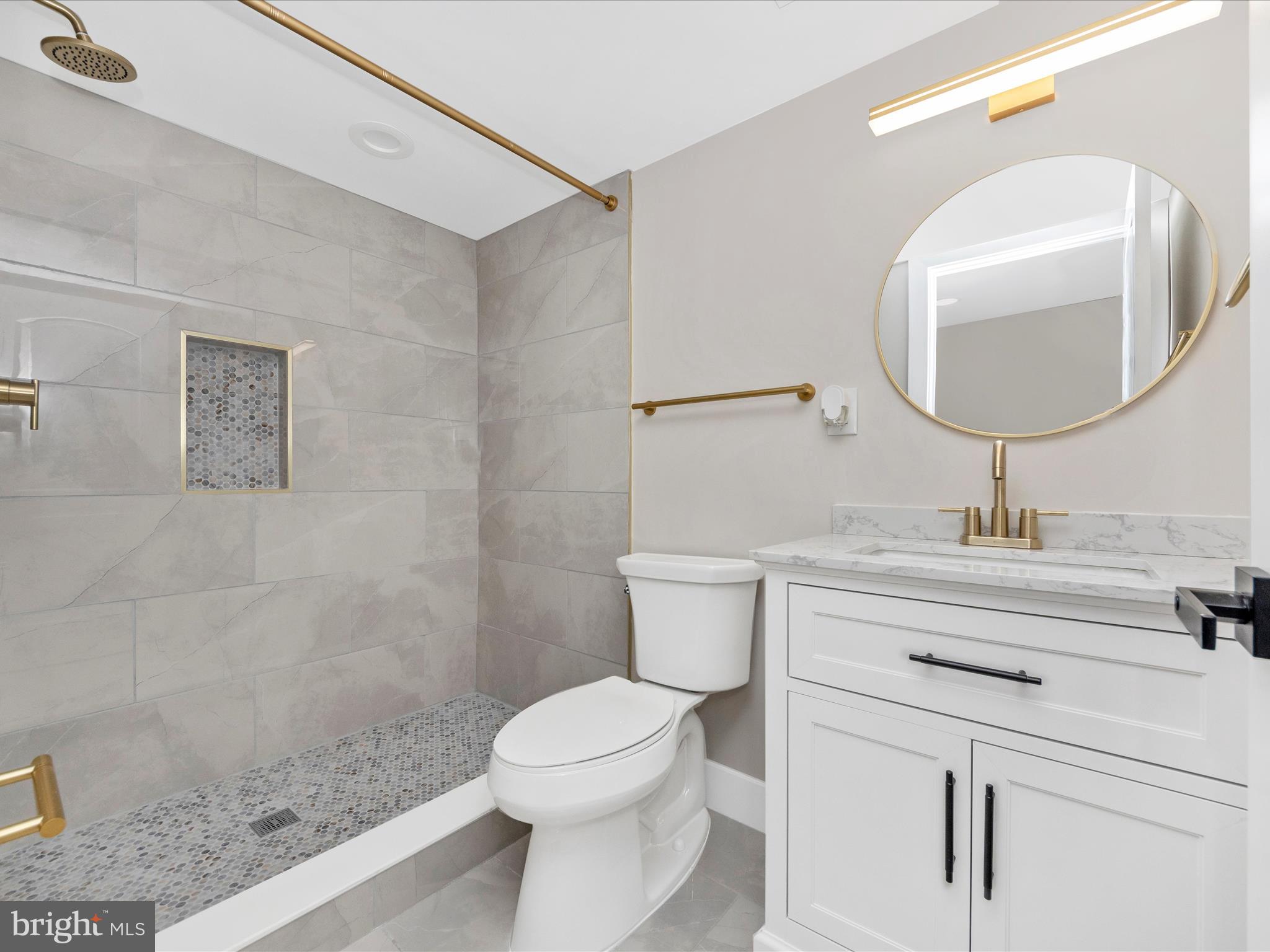 2812 Manoff Road Halethorpe, MD 21227 - Photo 36 of 55 a bathroom with a sink a toilet and a mirror