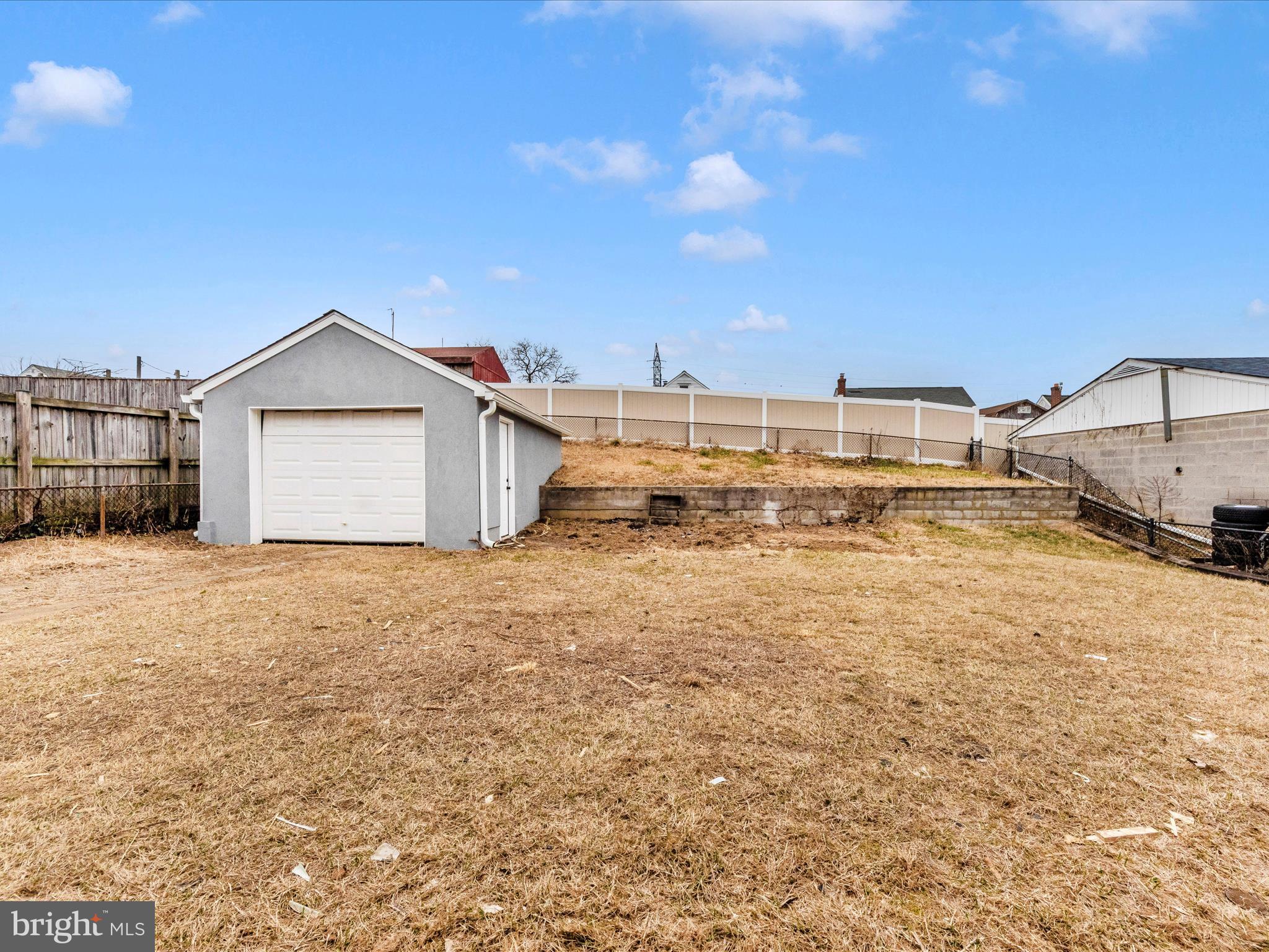 2812 Manoff Road Halethorpe, MD 21227 - Photo 45 of 55 a view of a dry yard with wooden fence