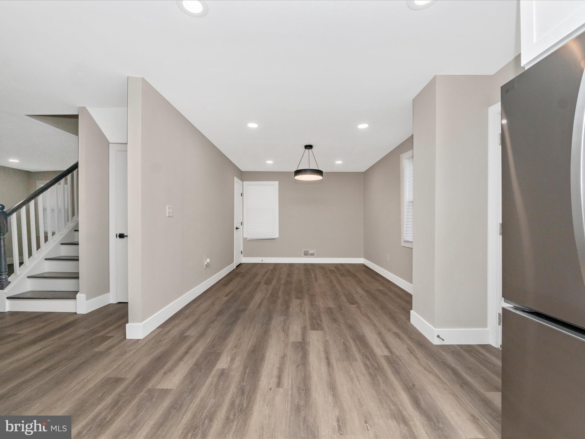 2812 Manoff Road Halethorpe, MD 21227 - Photo 10 of 55 a view of a room with wooden floor and electronic appliances