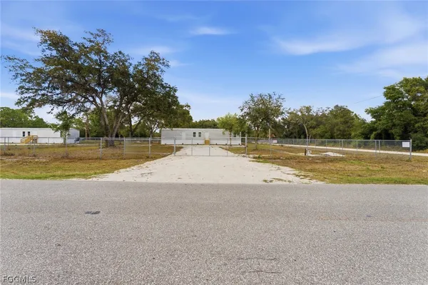 a view of a swimming pool and a yard