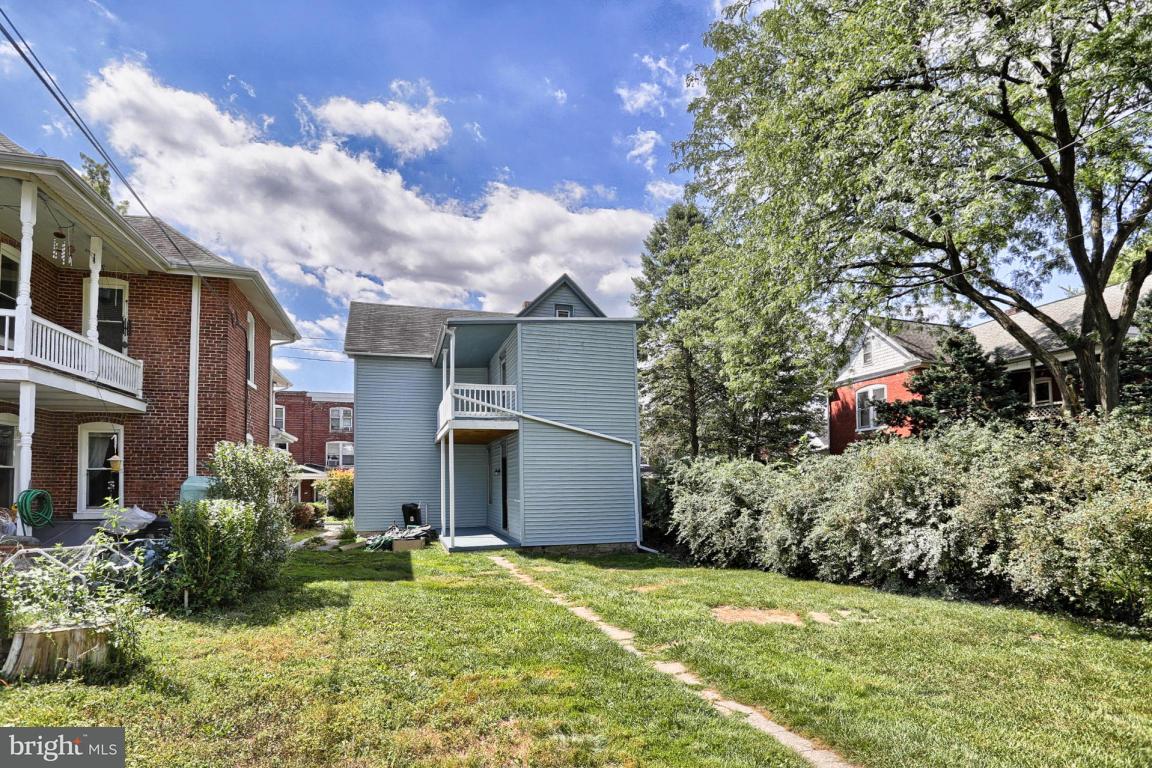 149 Front Street Lititz, PA 17543 - Photo 11 of 33 a backyard of a house with large trees and plants