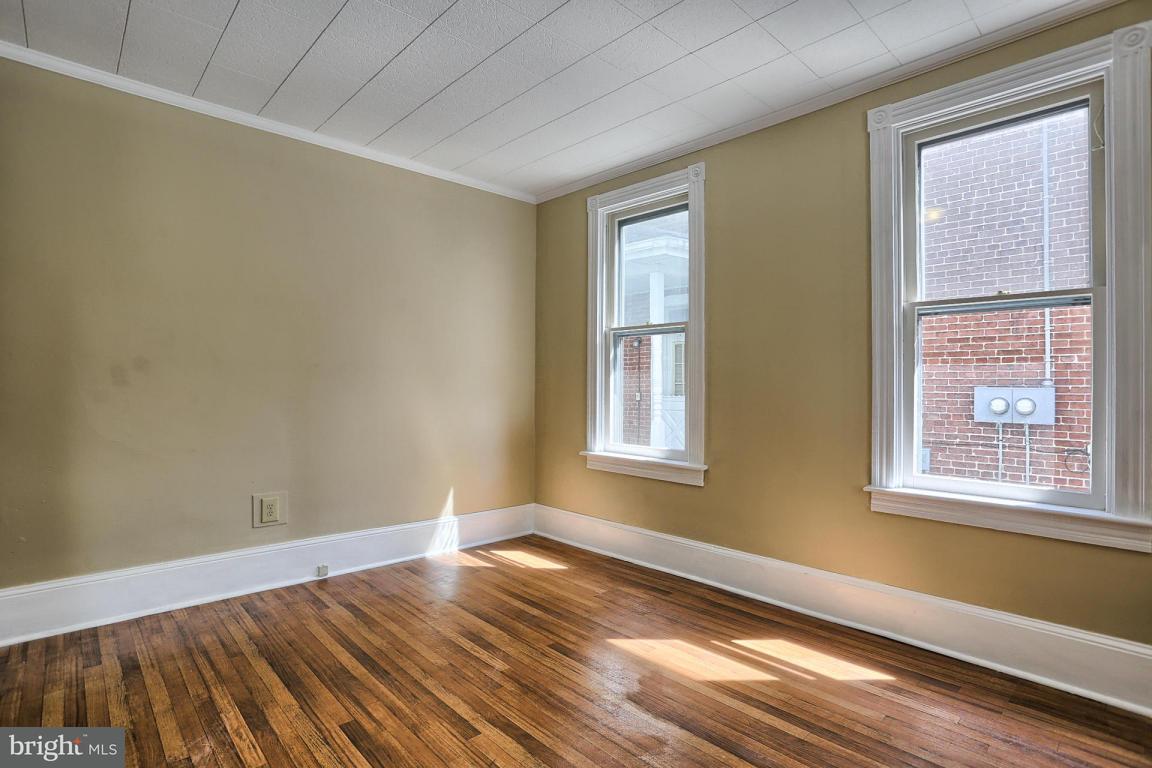 149 Front Street Lititz, PA 17543 - Photo 17 of 33 a view of an empty room with wooden floor and a window