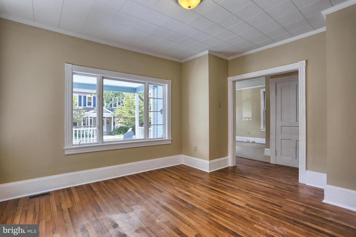 149 Front Street Lititz, PA 17543 - Photo 19 of 33 a view of an empty room with wooden floor and a window