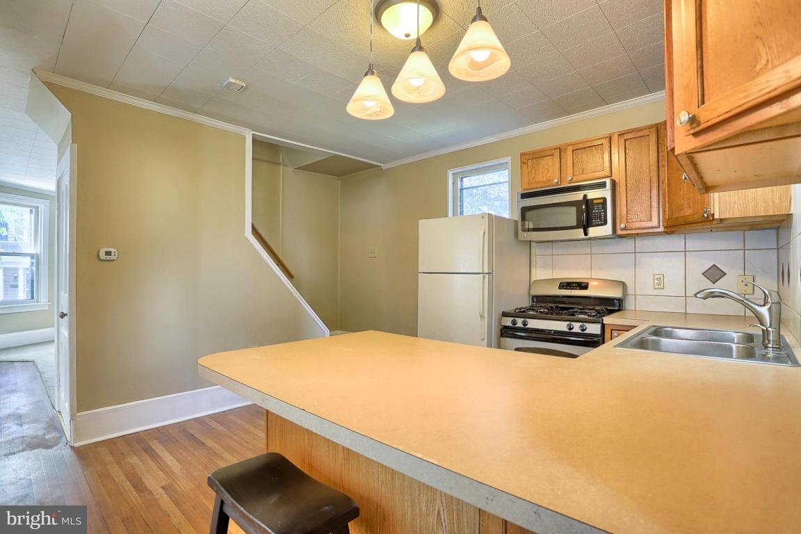 149 Front Street Lititz, PA 17543 - Photo 24 of 33 a kitchen with a refrigerator a stove and a sink
