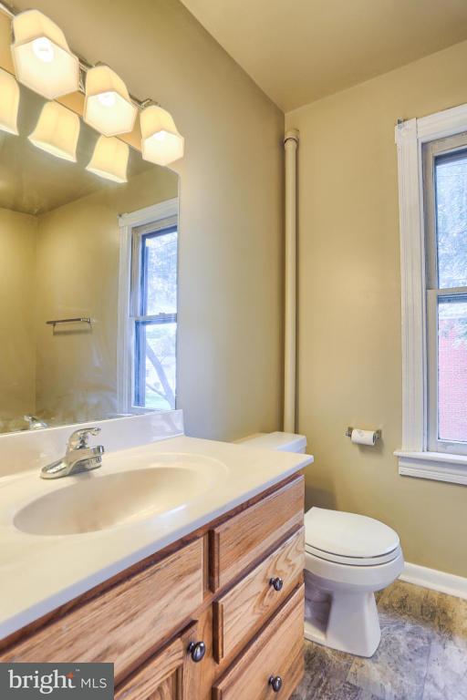 149 Front Street Lititz, PA 17543 - Photo 32 of 33 a bathroom with a sink a toilet and mirror