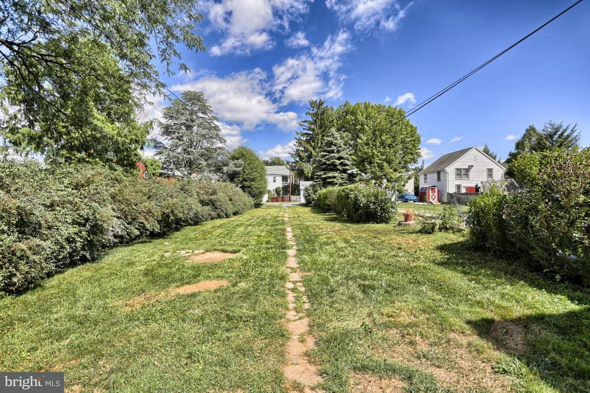 149 Front Street Lititz, PA 17543 - Photo 7 of 33 a view of a garden with a building in the background