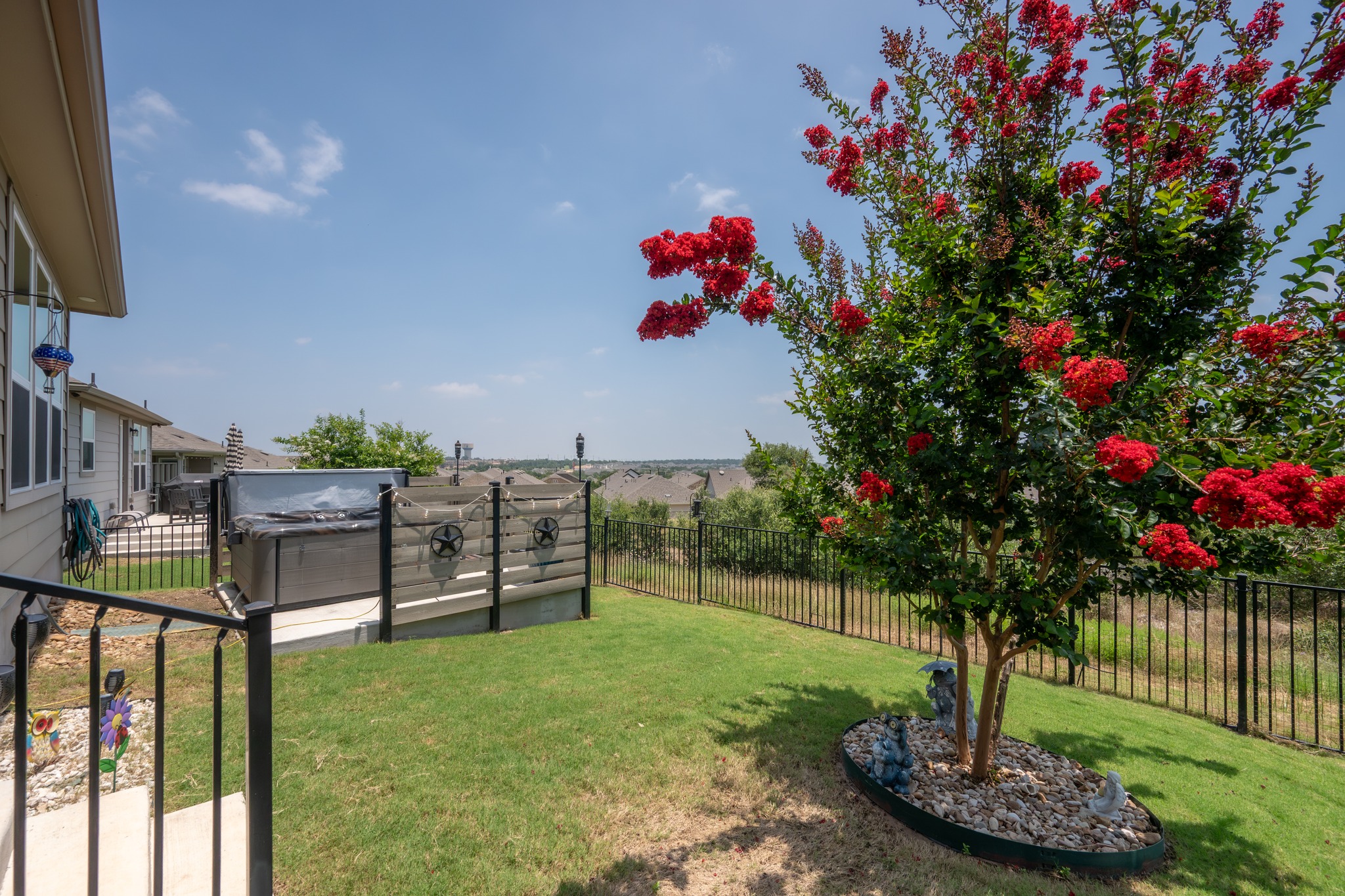 202 Yorktown Street Georgetown, TX 78633 - Photo 21 of 35 Unwind on the covered patio or relax in the hot tub and enjoy serene views.