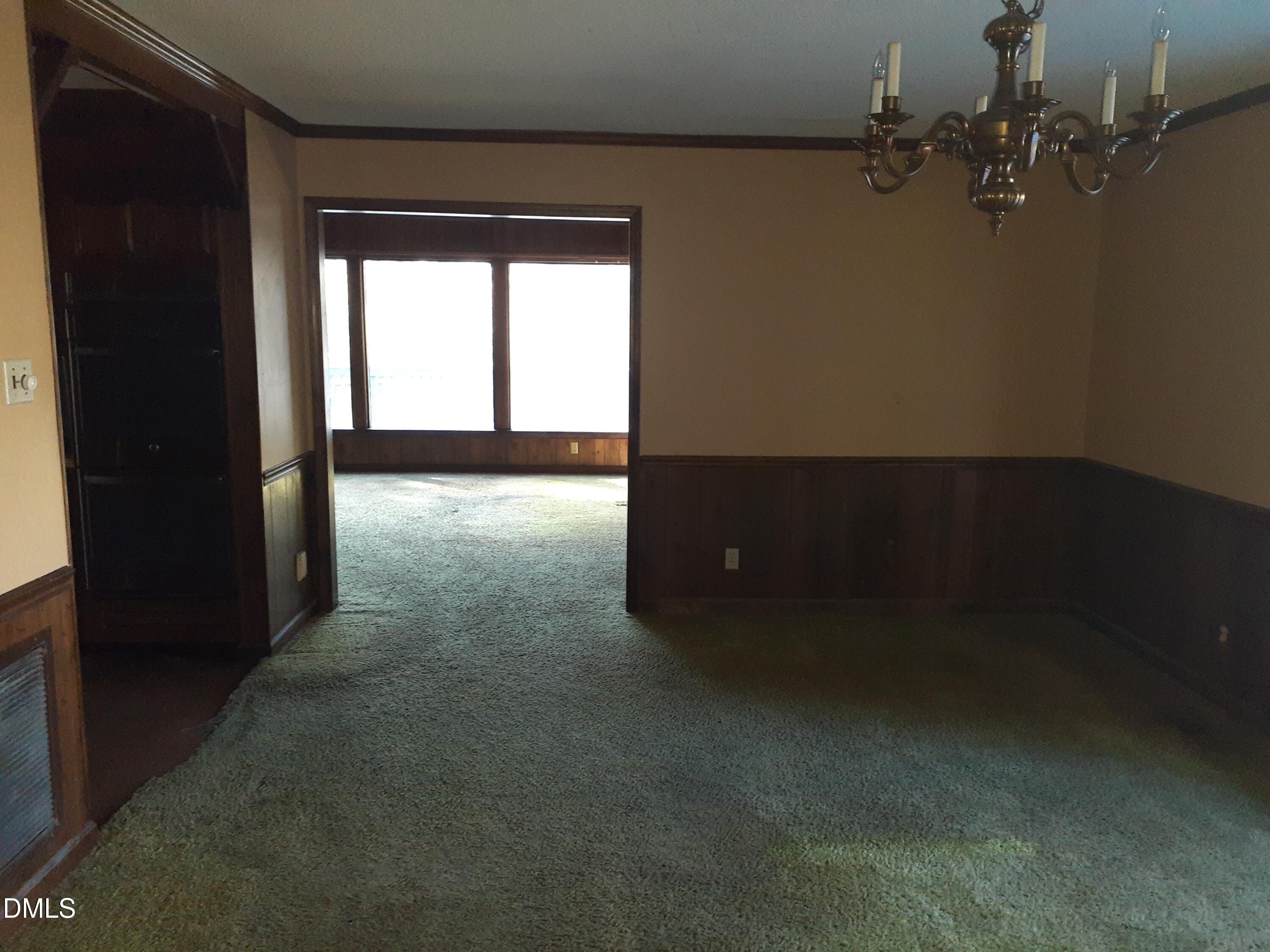 1576 Munns Road Creedmoor, NC 27522 - Photo 11 of 25 wooden floor and window in an empty room