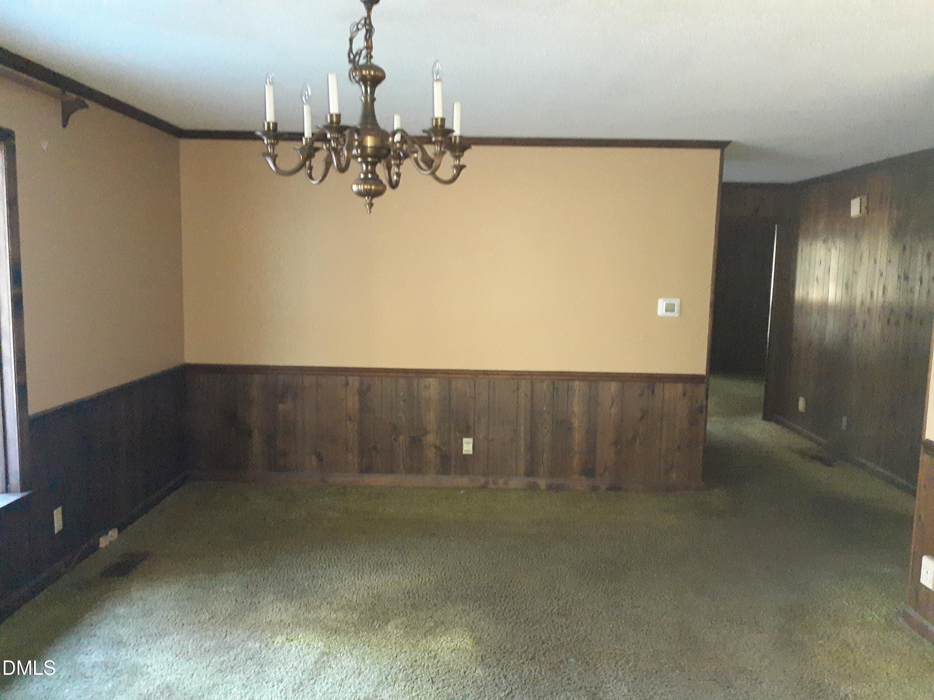 1576 Munns Road Creedmoor, NC 27522 - Photo 12 of 25 a view of a livingroom with a chandelier