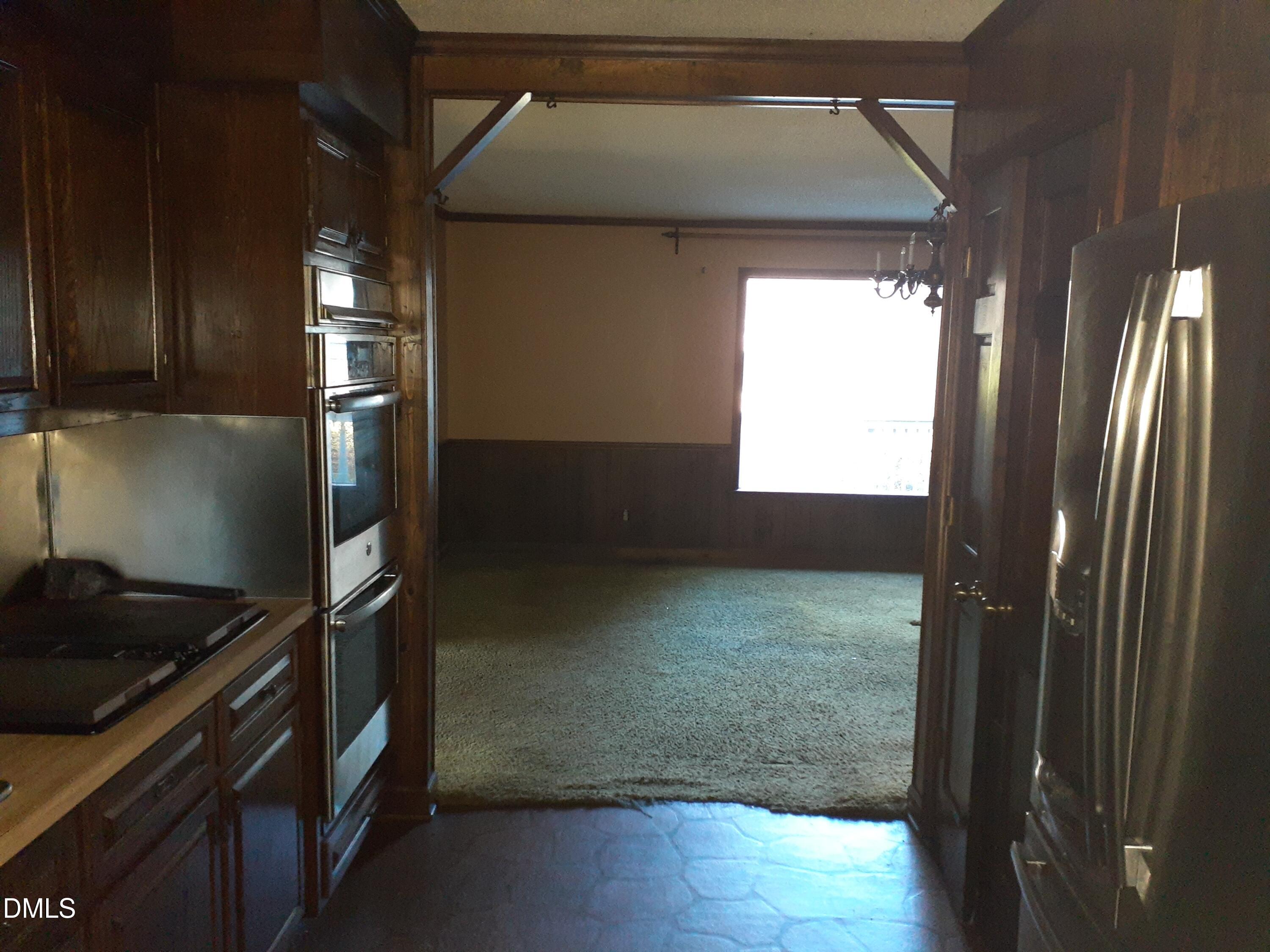 1576 Munns Road Creedmoor, NC 27522 - Photo 14 of 25 a kitchen with a refrigerator and window