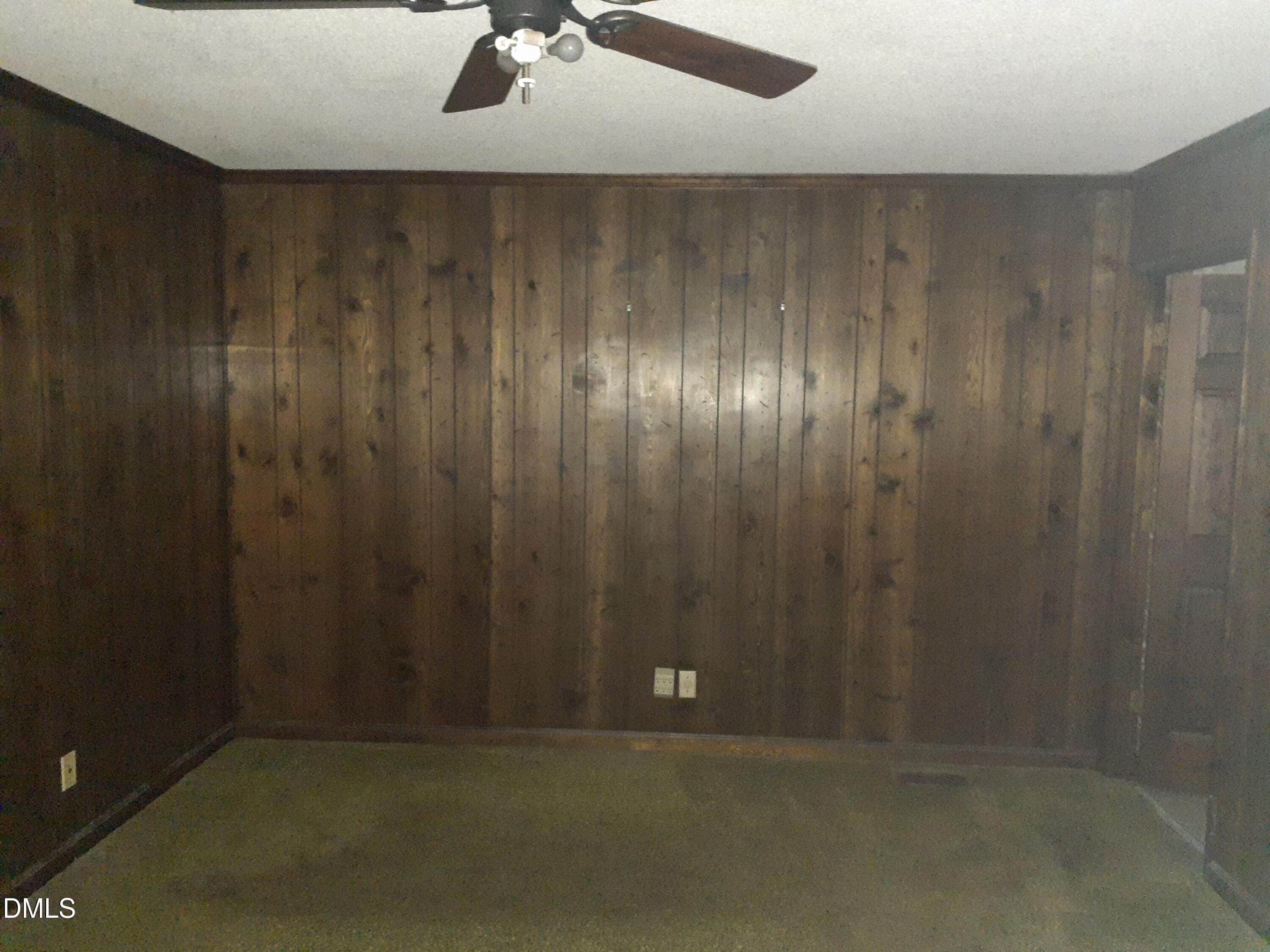 1576 Munns Road Creedmoor, NC 27522 - Photo 15 of 25 a view of room with a ceiling fan and carpet