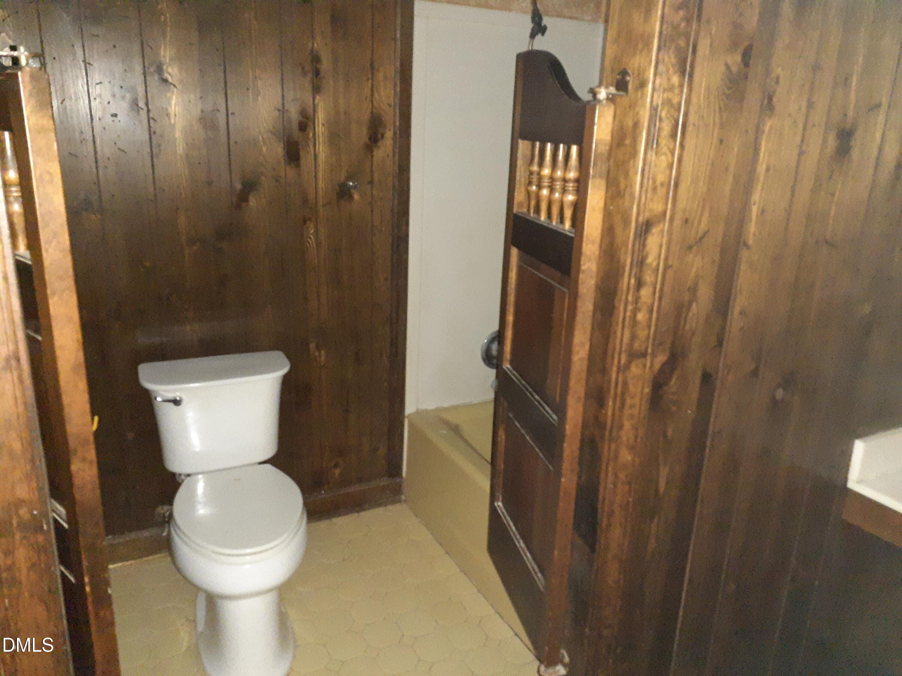 1576 Munns Road Creedmoor, NC 27522 - Photo 23 of 25 a bathroom with a toilet and a sink