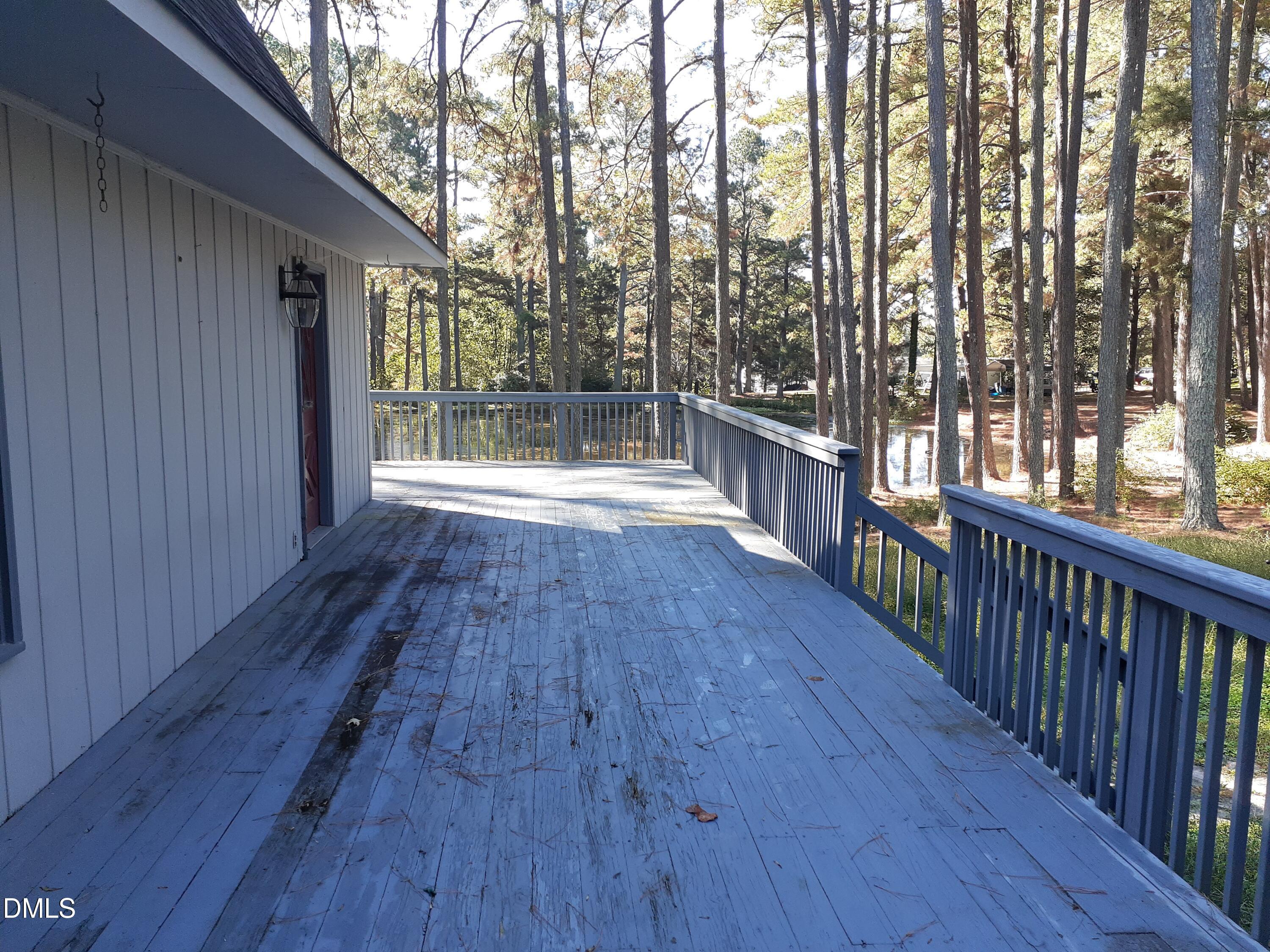 1576 Munns Road Creedmoor, NC 27522 - Photo 7 of 25 a view of a room with wooden floor and trees