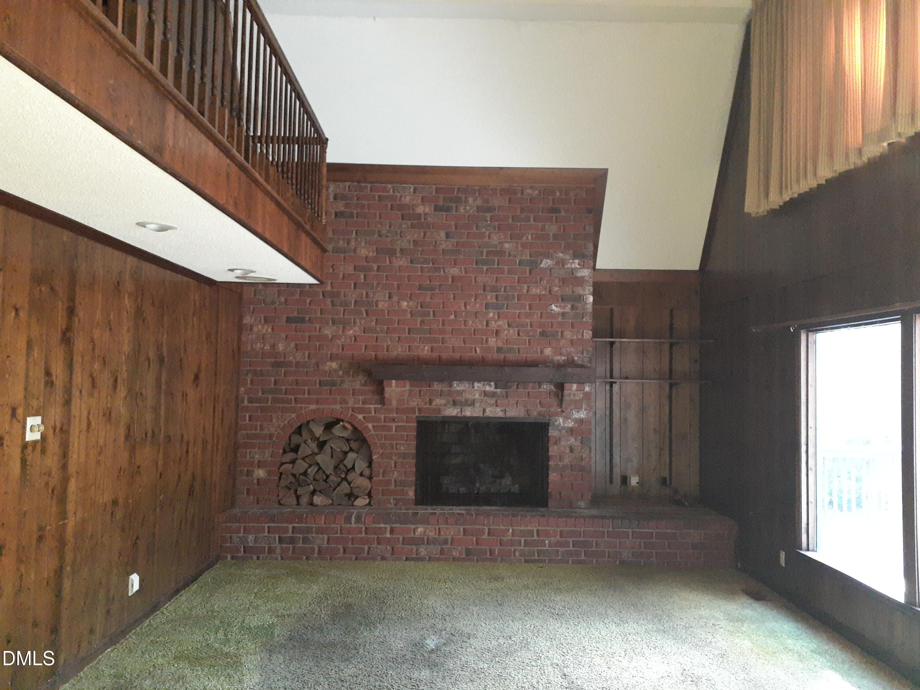 1576 Munns Road Creedmoor, NC 27522 - Photo 9 of 25 a view of fireplace and window