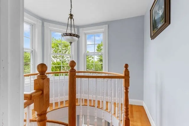 a front view of a house with wooden floor