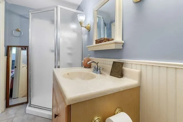 a bathroom with a sink and mirror