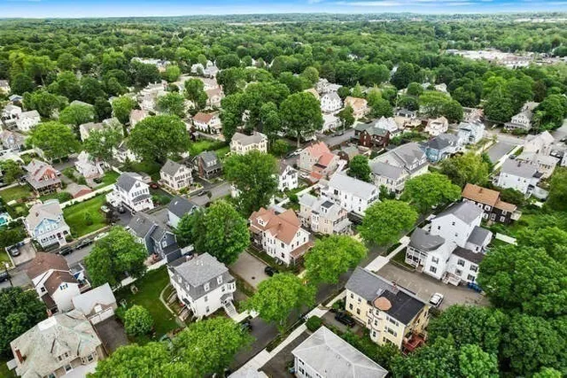 an aerial view of multiple house with outdoor space