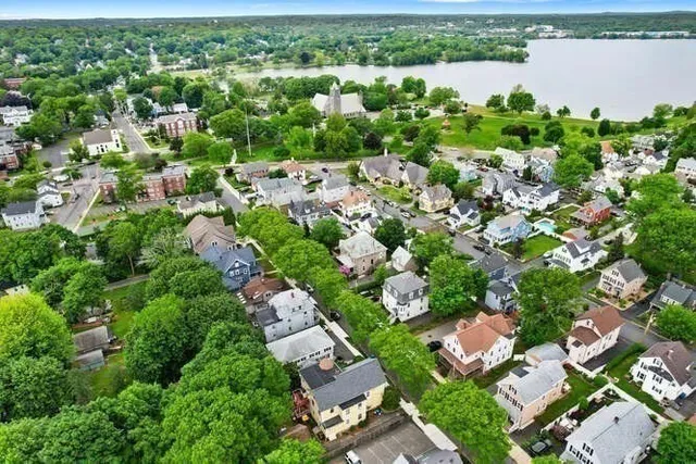 an aerial view of a city with lake view