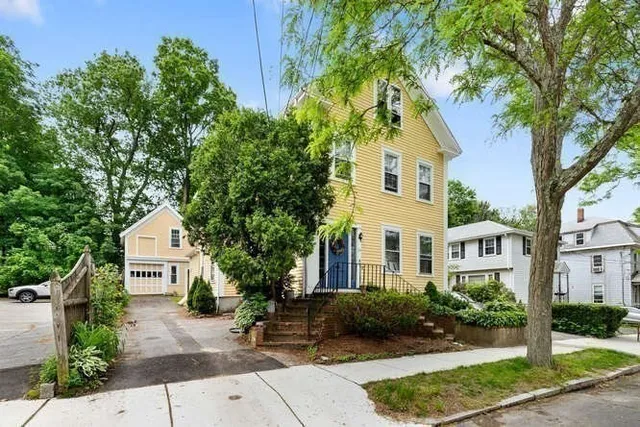 front view of a house with a yard
