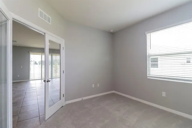 an empty room with windows