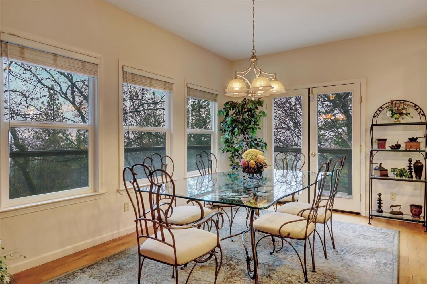 17036 Alice Way Grass Valley, CA 95949 - Photo 4 of 58 a dining room with furniture a chandelier and window