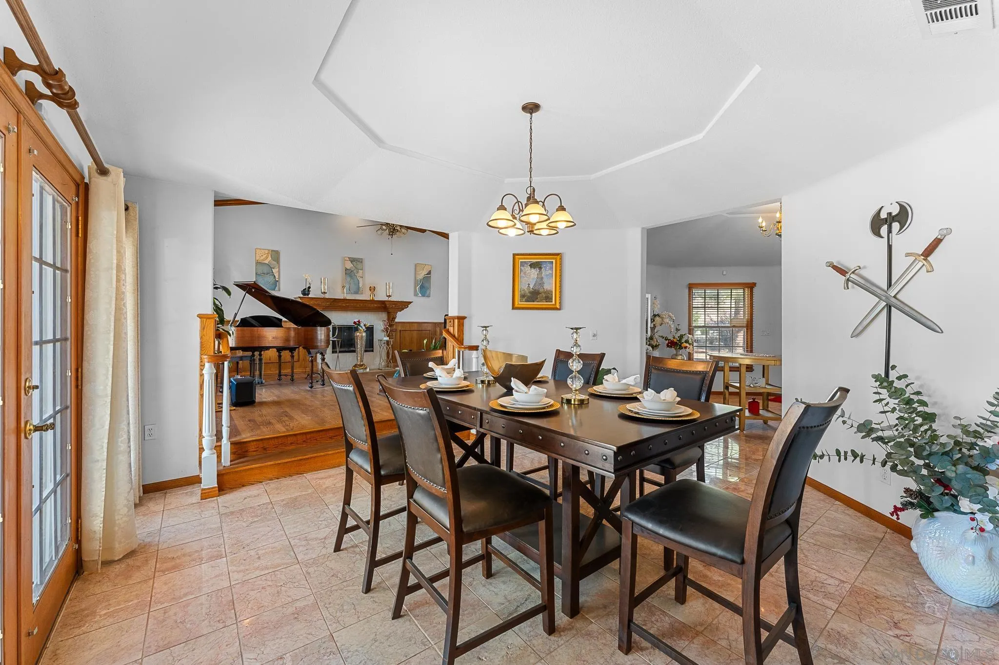 19775 Symeron Road Apple Valley, CA 92307 - Photo 15 of 73 a view of a dining room with furniture and chandelier