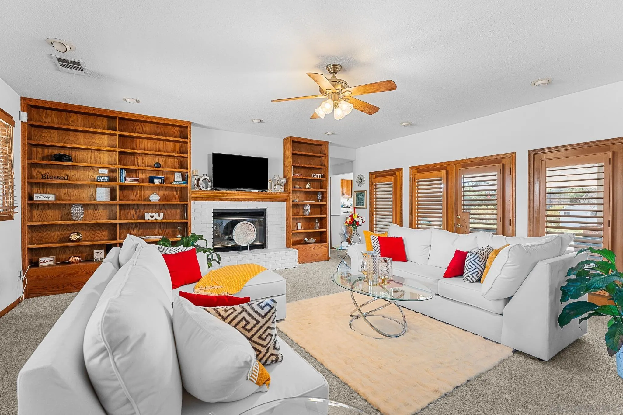 19775 Symeron Road Apple Valley, CA 92307 - Photo 23 of 73 a living room with fireplace furniture and a flat screen tv