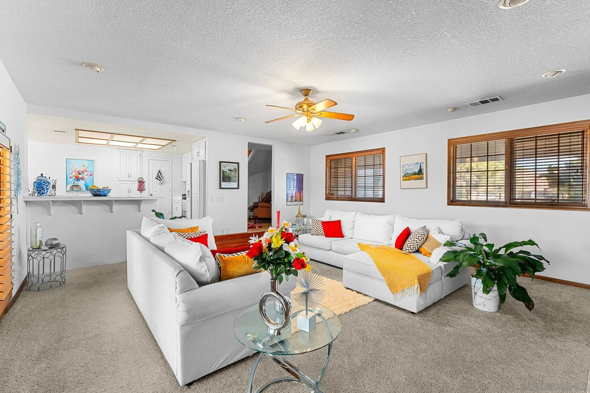 19775 Symeron Road Apple Valley, CA 92307 - Photo 25 of 73 a living room with furniture and a potted plant