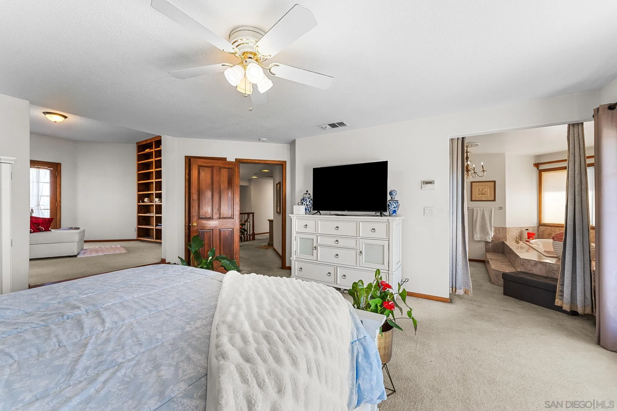 19775 Symeron Road Apple Valley, CA 92307 - Photo 35 of 73 a bedroom with a bed and a flat screen tv