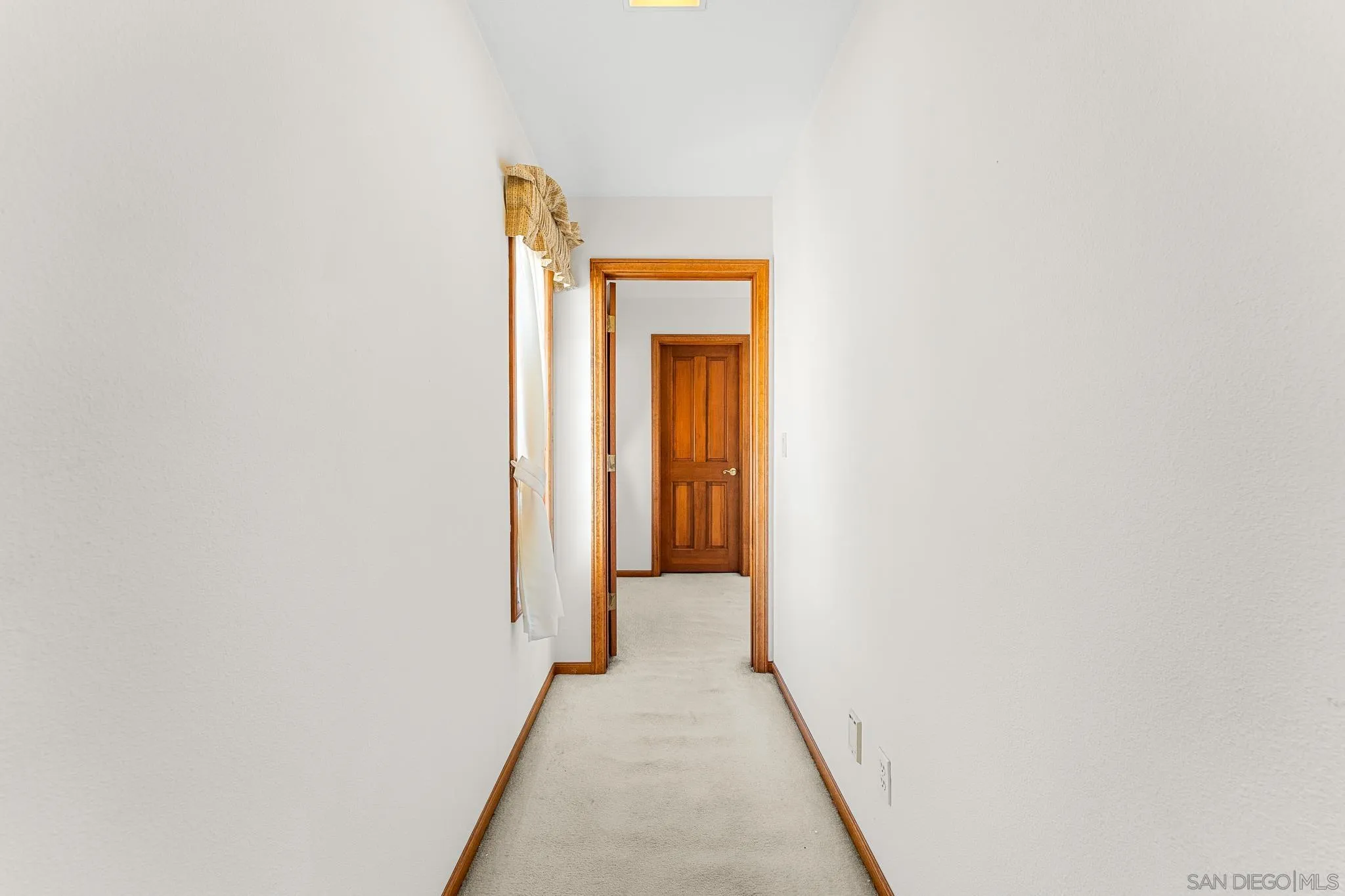 19775 Symeron Road Apple Valley, CA 92307 - Photo 46 of 73 a view of a hallway with a white walls