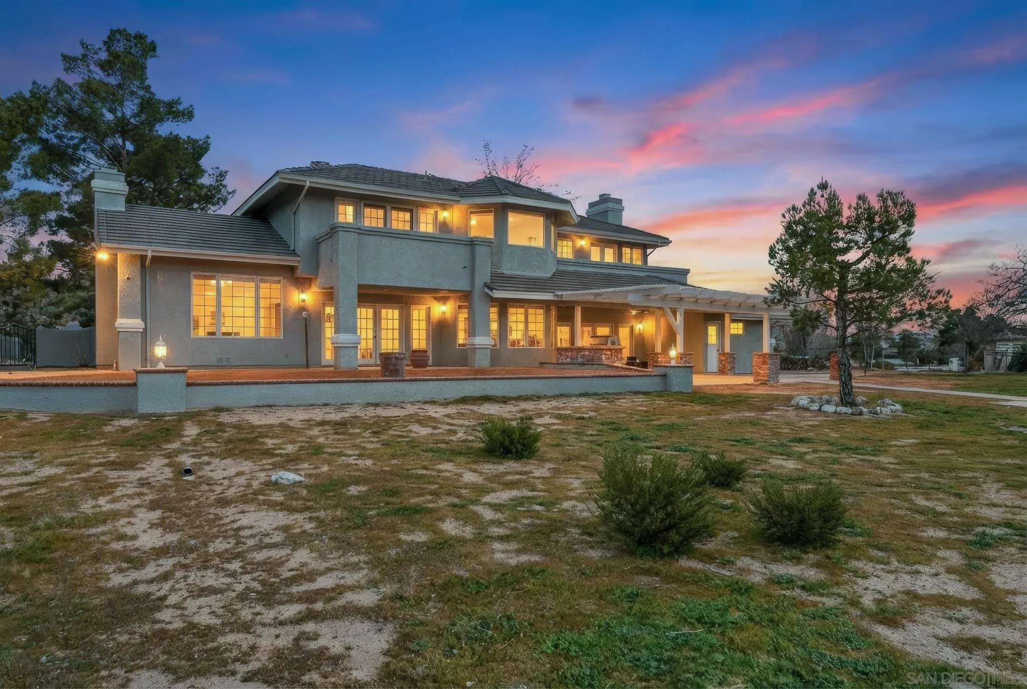 19775 Symeron Road Apple Valley, CA 92307 - Photo 5 of 73 a front view of a house with a yard