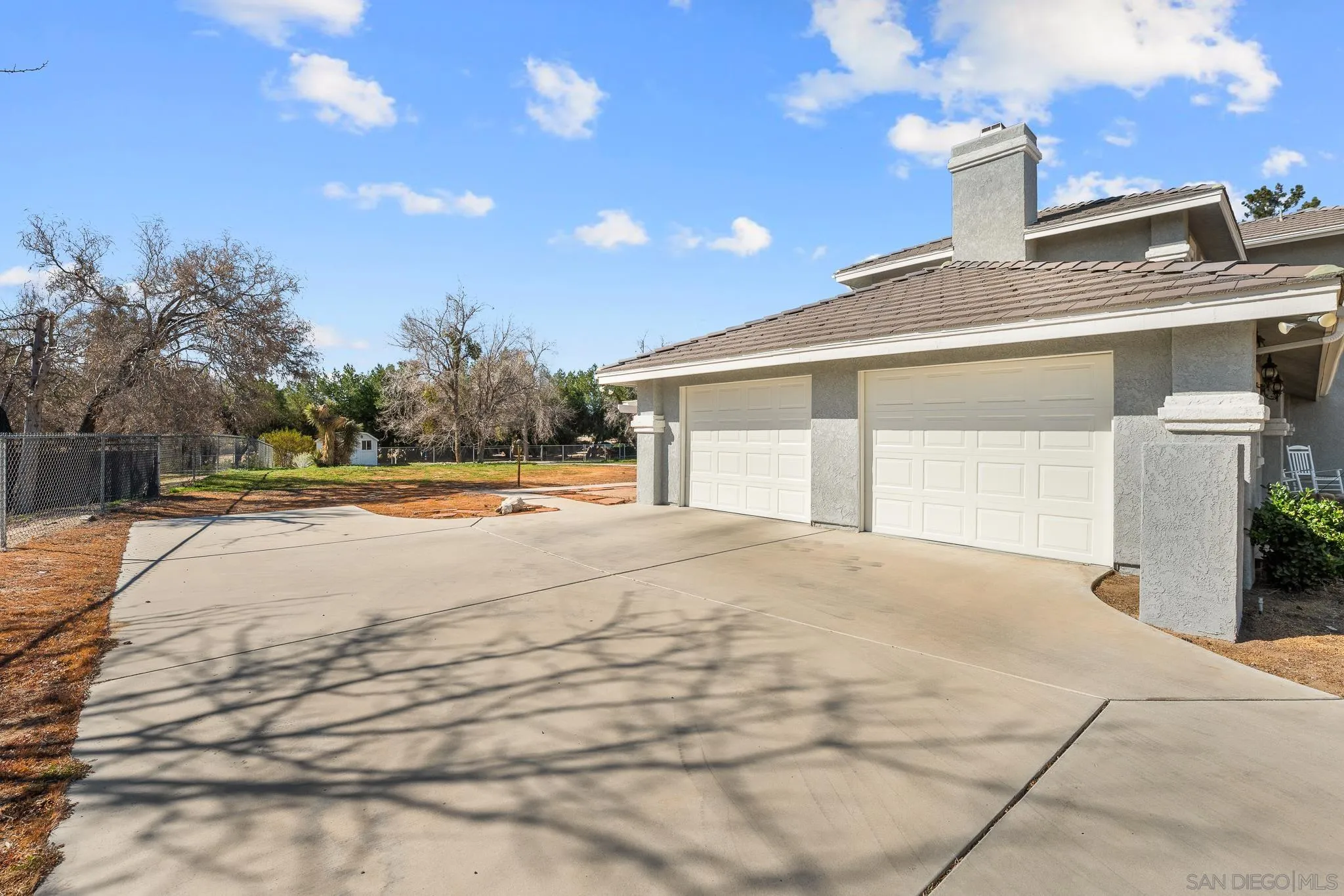 19775 Symeron Road Apple Valley, CA 92307 - Photo 53 of 73 a view of a house with a yard and potted plants