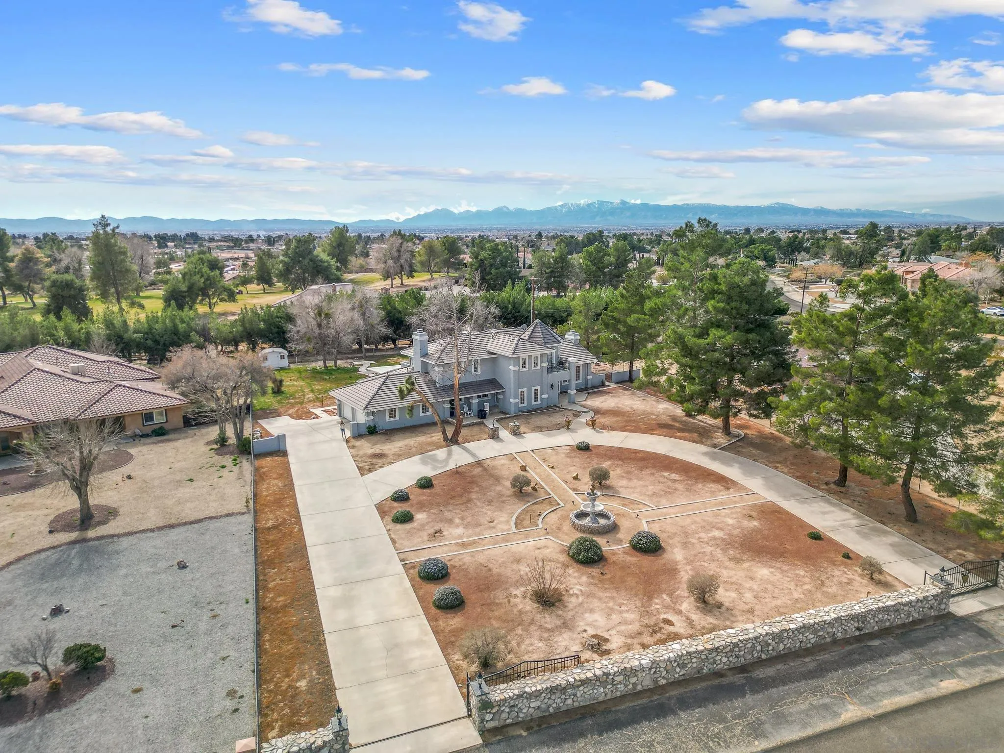 19775 Symeron Road Apple Valley, CA 92307 - Photo 7 of 73 a view of a swimming pool with lawn chairs and couches