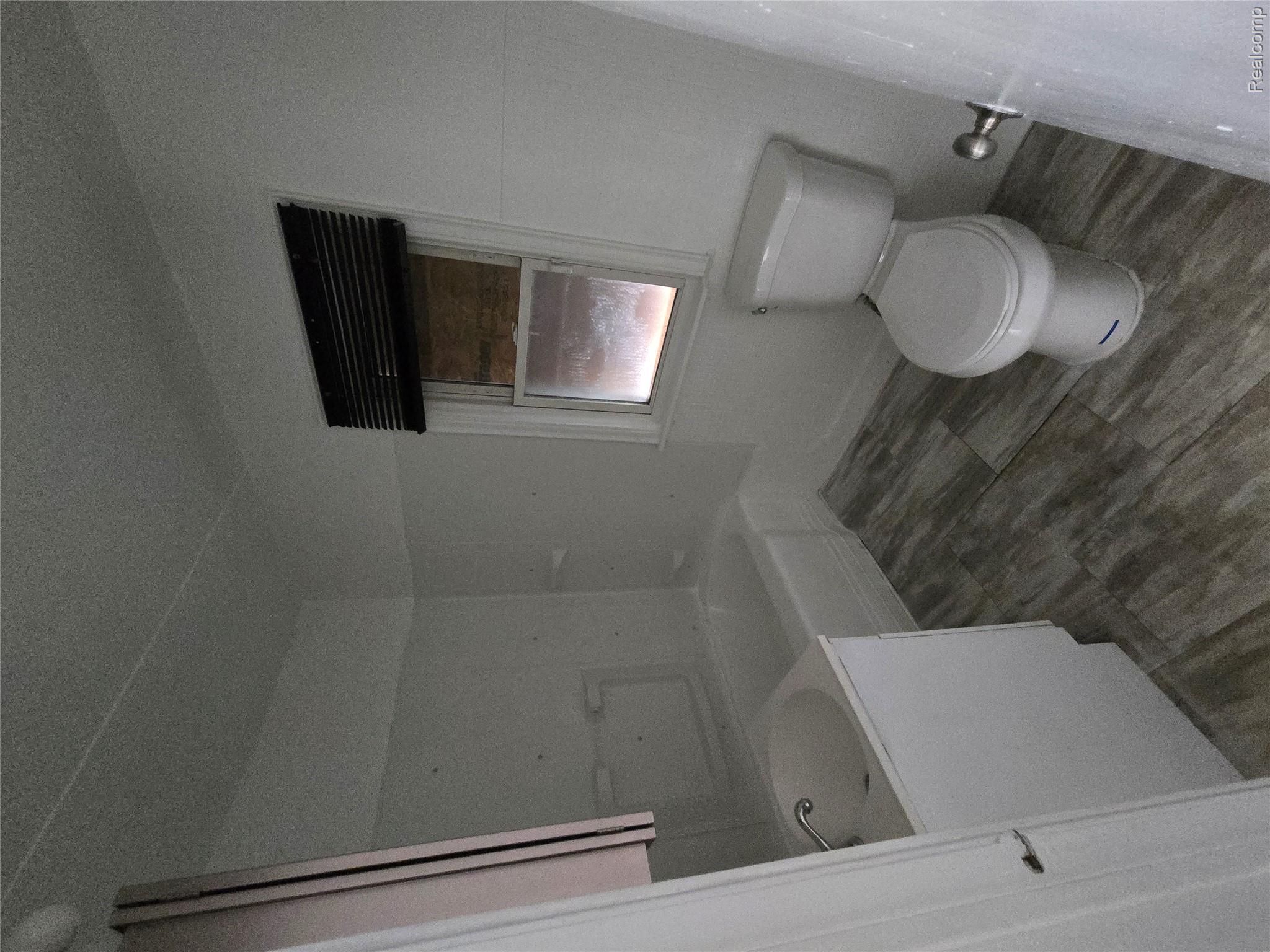 18119 Cornwall Street Detroit, MI 48224 - Photo 8 of 18 Full bath featuring vanity and a tub to relax in