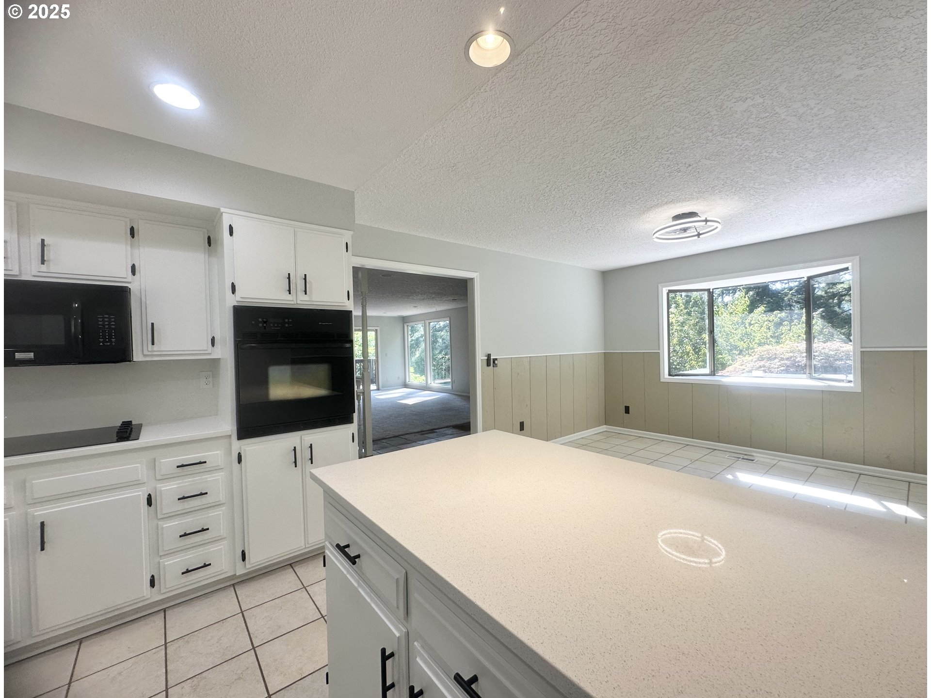 20698 South Mattoon Road Estacada, OR 97023 - Photo 12 of 41 a kitchen with granite countertop a stove a sink and a microwave