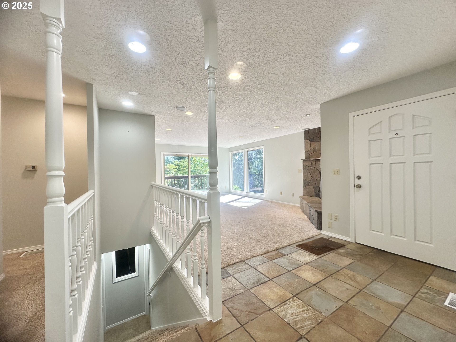 20698 South Mattoon Road Estacada, OR 97023 - Photo 21 of 41 a spacious bedroom with a large bed and a chandelier