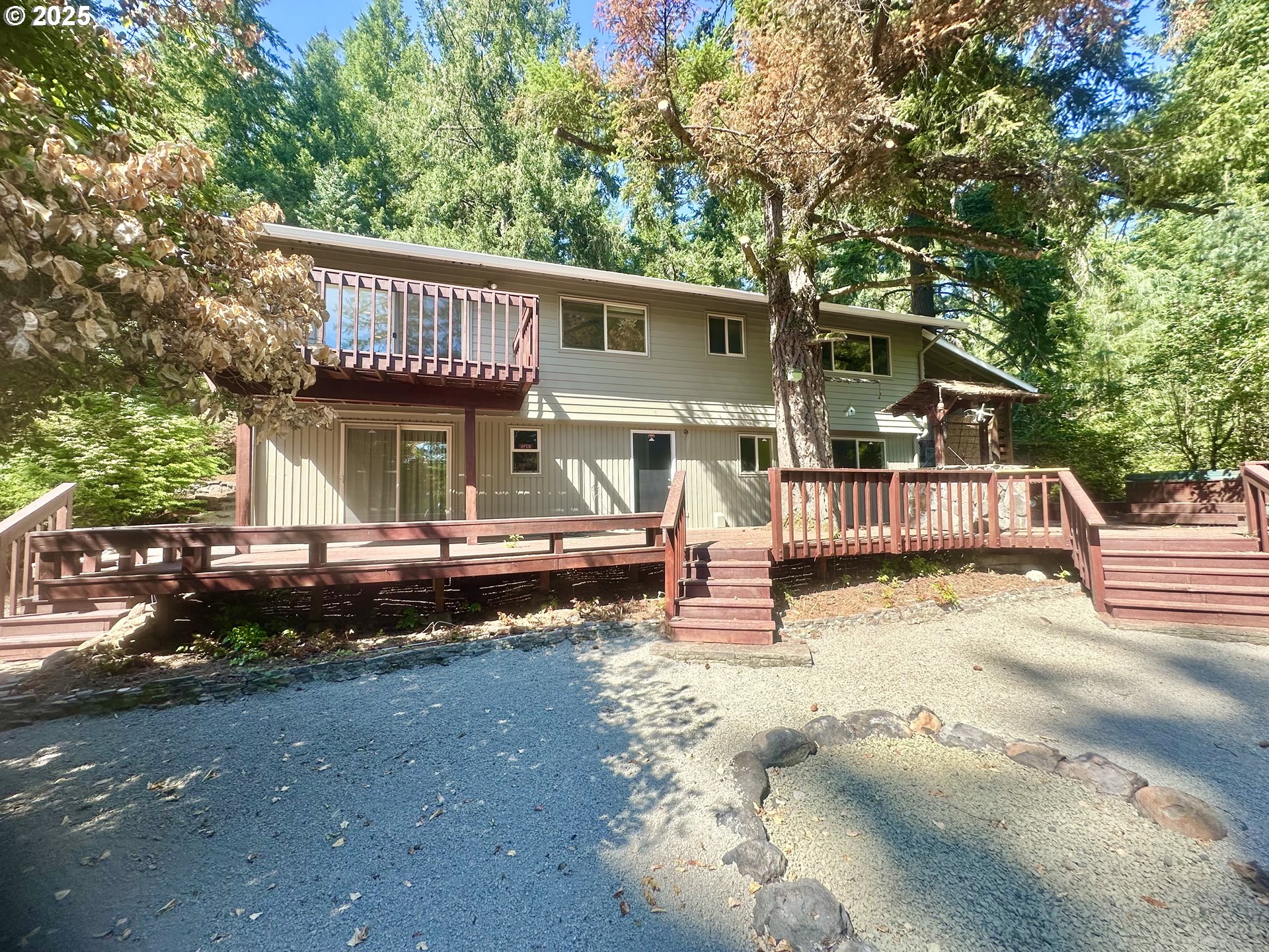 20698 South Mattoon Road Estacada, OR 97023 - Photo 36 of 41 a view of a house with a wooden bench in a yard