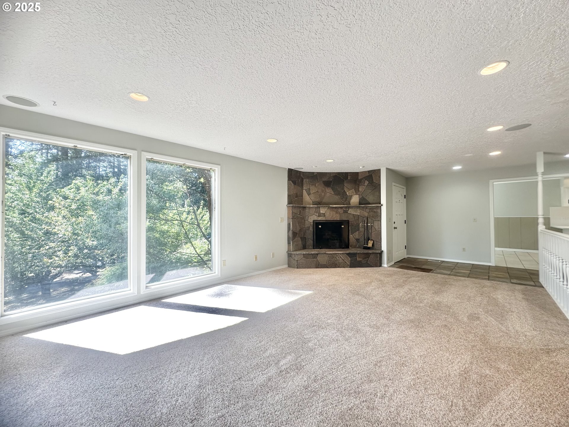 20698 South Mattoon Road Estacada, OR 97023 - Photo 5 of 41 a view of an empty room with a fireplace and a large window