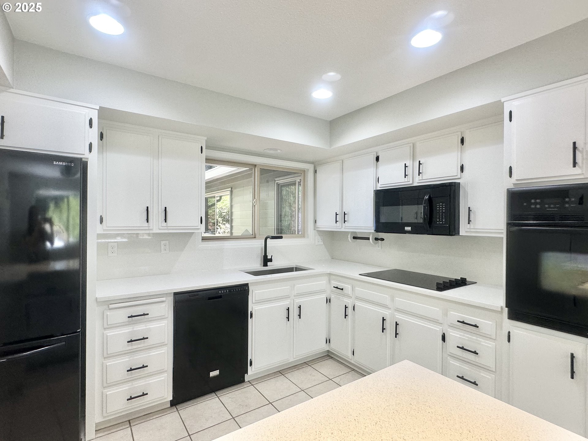 20698 South Mattoon Road Estacada, OR 97023 - Photo 6 of 41 a kitchen with white cabinets and stainless steel appliances
