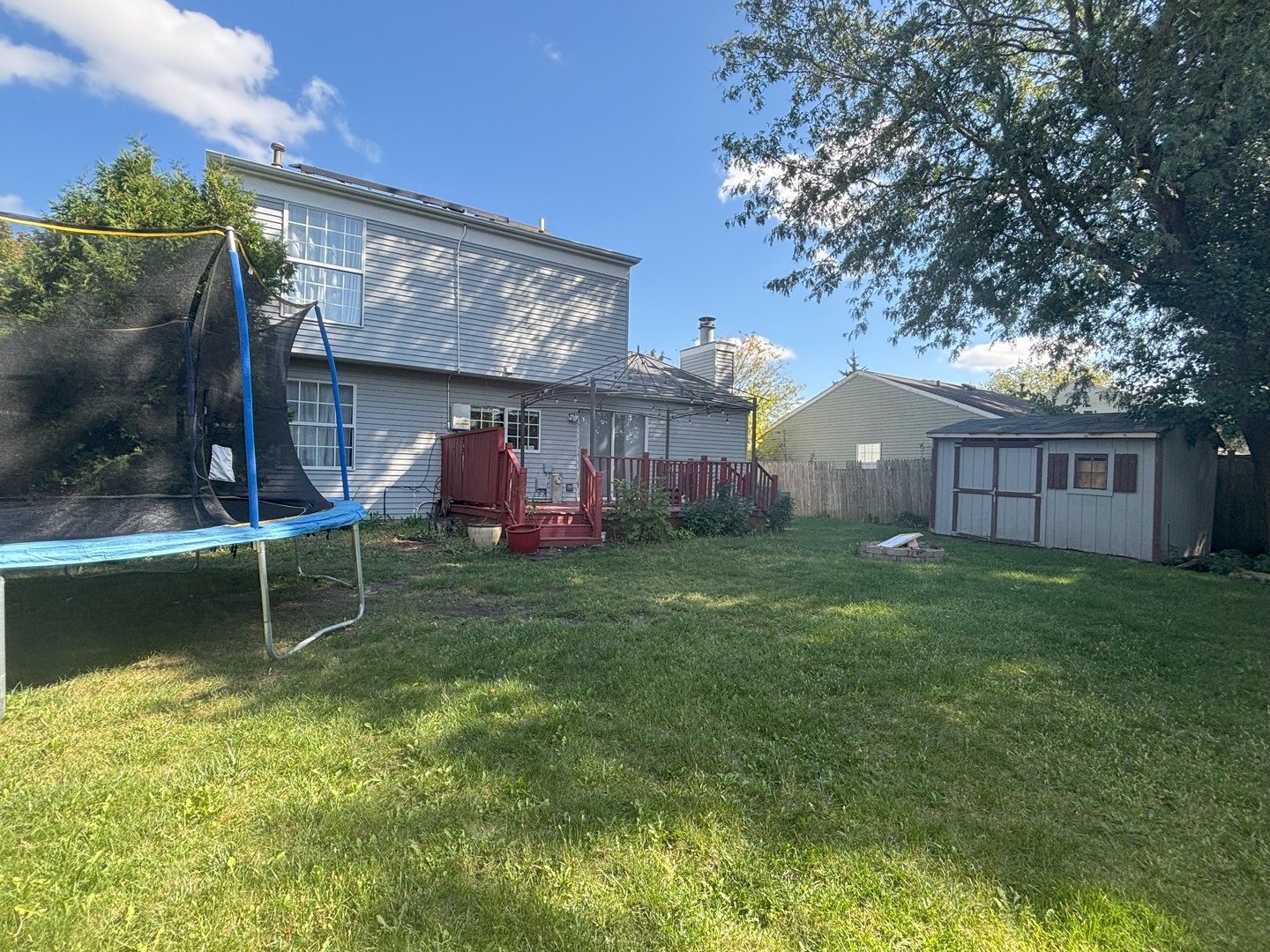 800 Indian Wells Circle Elgin, IL 60123 - Photo 16 of 17 a front view of a house with a garden