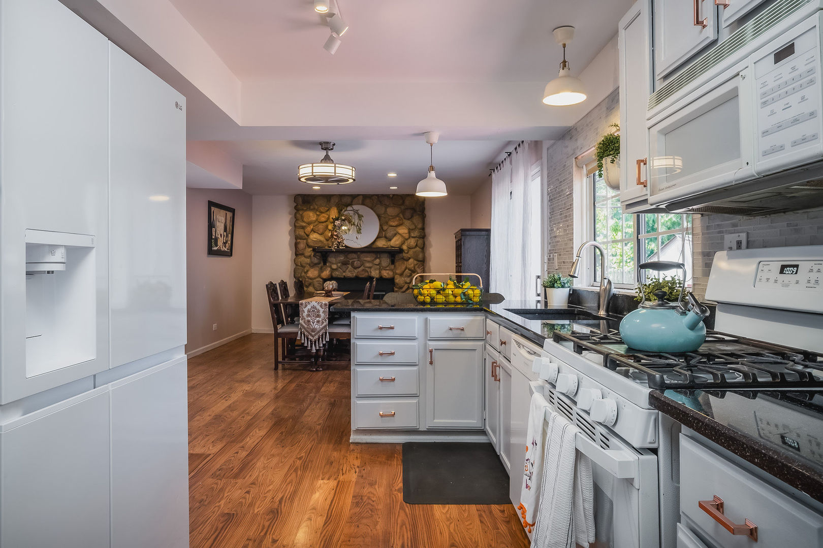 800 Indian Wells Circle Elgin, IL 60123 - Photo 5 of 17 a kitchen with a sink cabinets and wooden floor