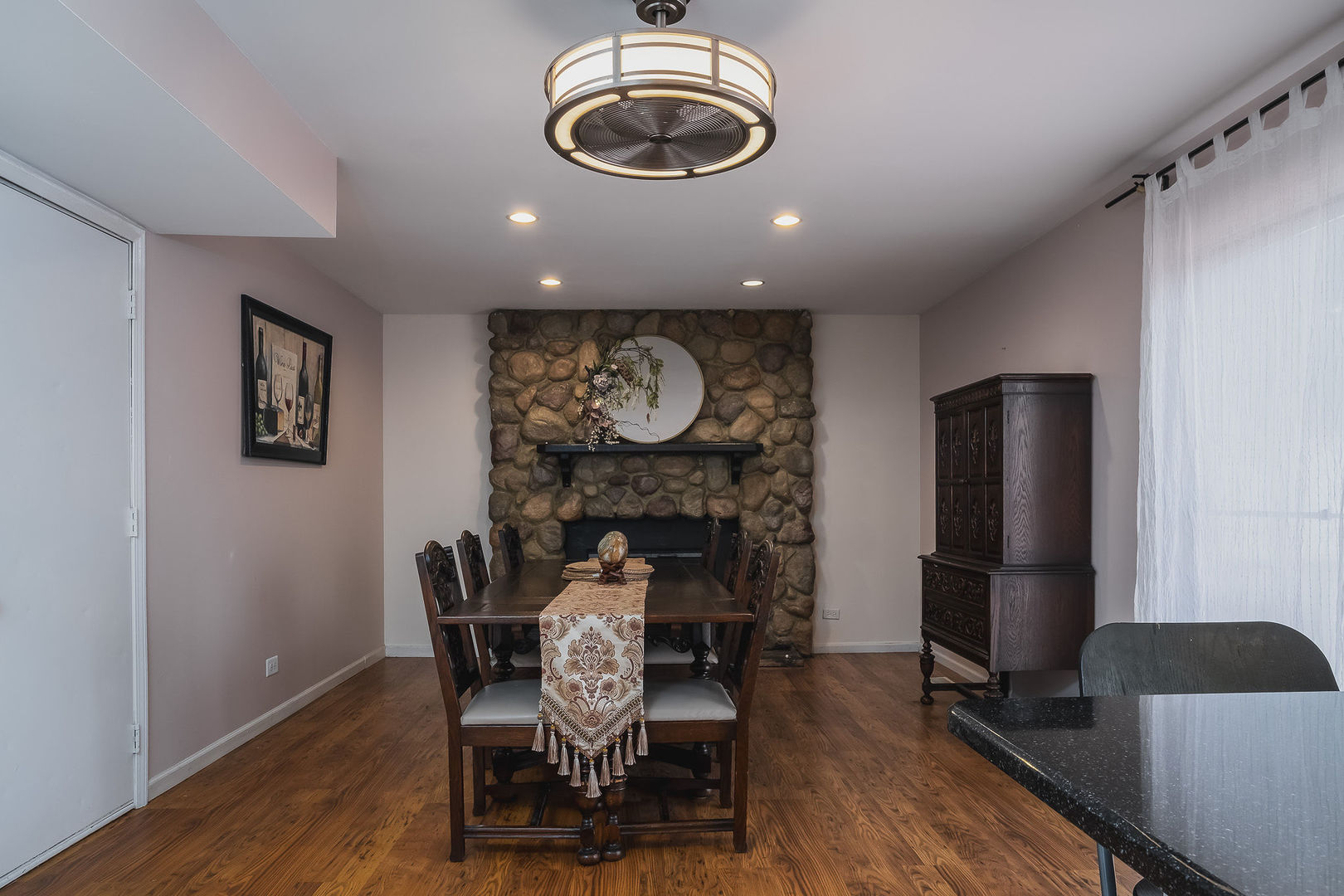800 Indian Wells Circle Elgin, IL 60123 - Photo 7 of 17 a view of a dining room with furniture and wooden floor