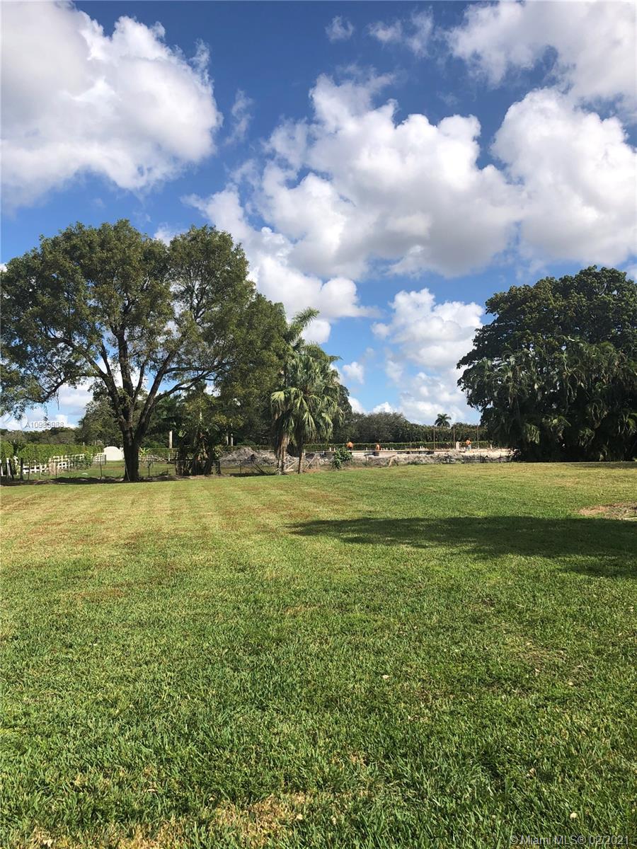 13240 Stirling Road Southwest Ranches, FL 33330 - Photo 5 of 13 a view of a golf course with a lake