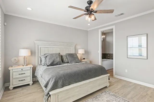 a bedroom with a bed and a tv