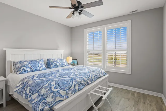 a bedroom with a large bed and a window