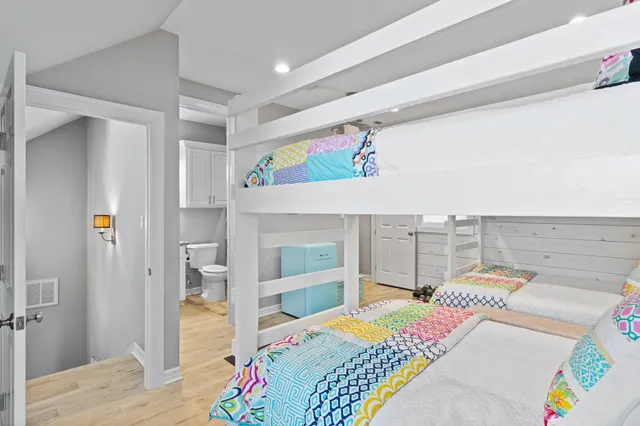 a bedroom with a bed and a view of bathroom