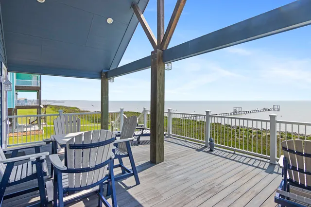 a view of a balcony with furniture and garden