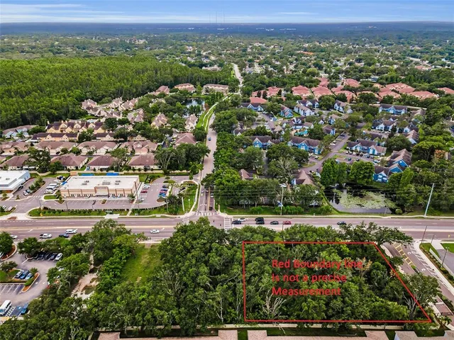 an aerial view of a city and mountain view in back