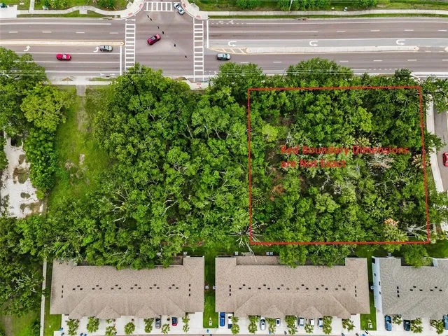 an aerial view of a house with a yard and garden