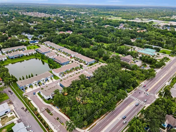 an aerial view of residential houses with outdoor space